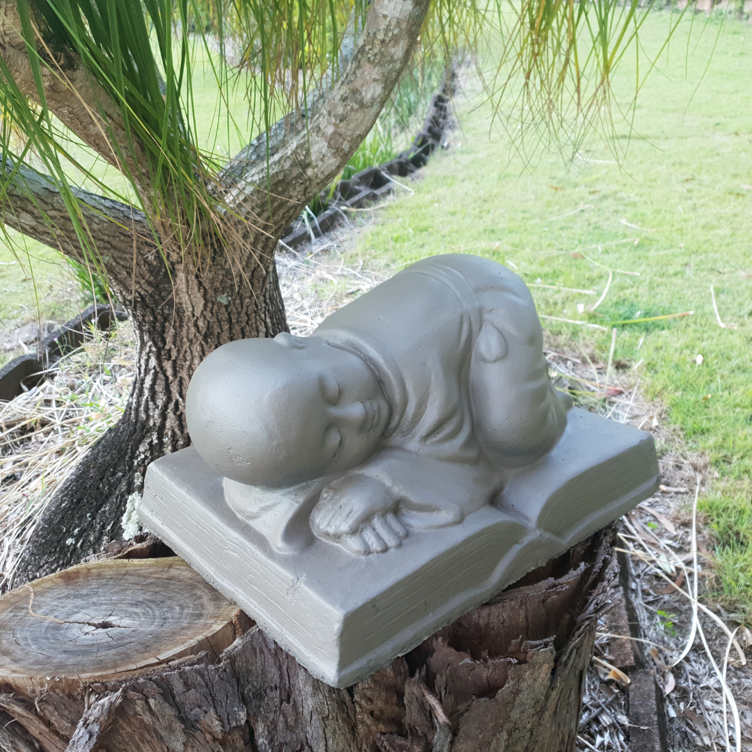 Sleeping Monk on Book Statue